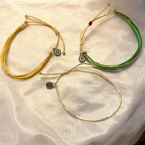 3 Pura Vida bracelets.